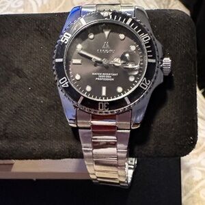 Silver with a Black face Watch very nice for dress up or casual wear